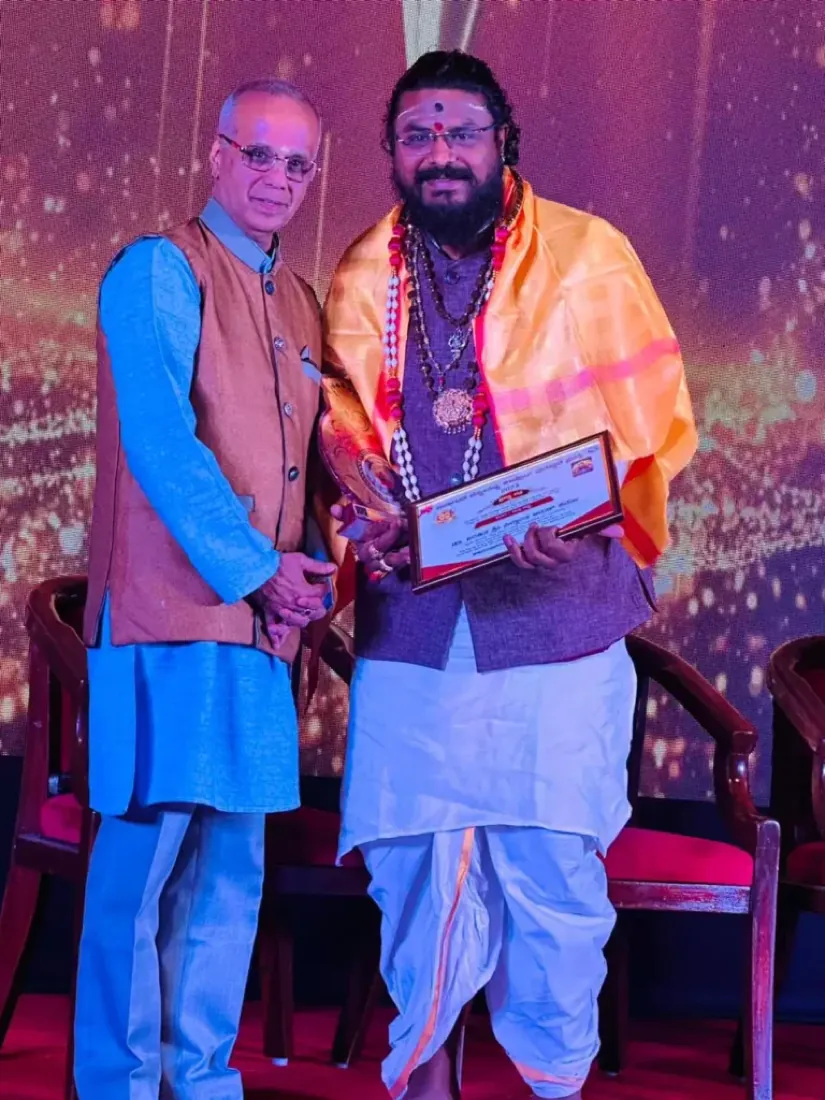 Guruji honoured with an award on stage